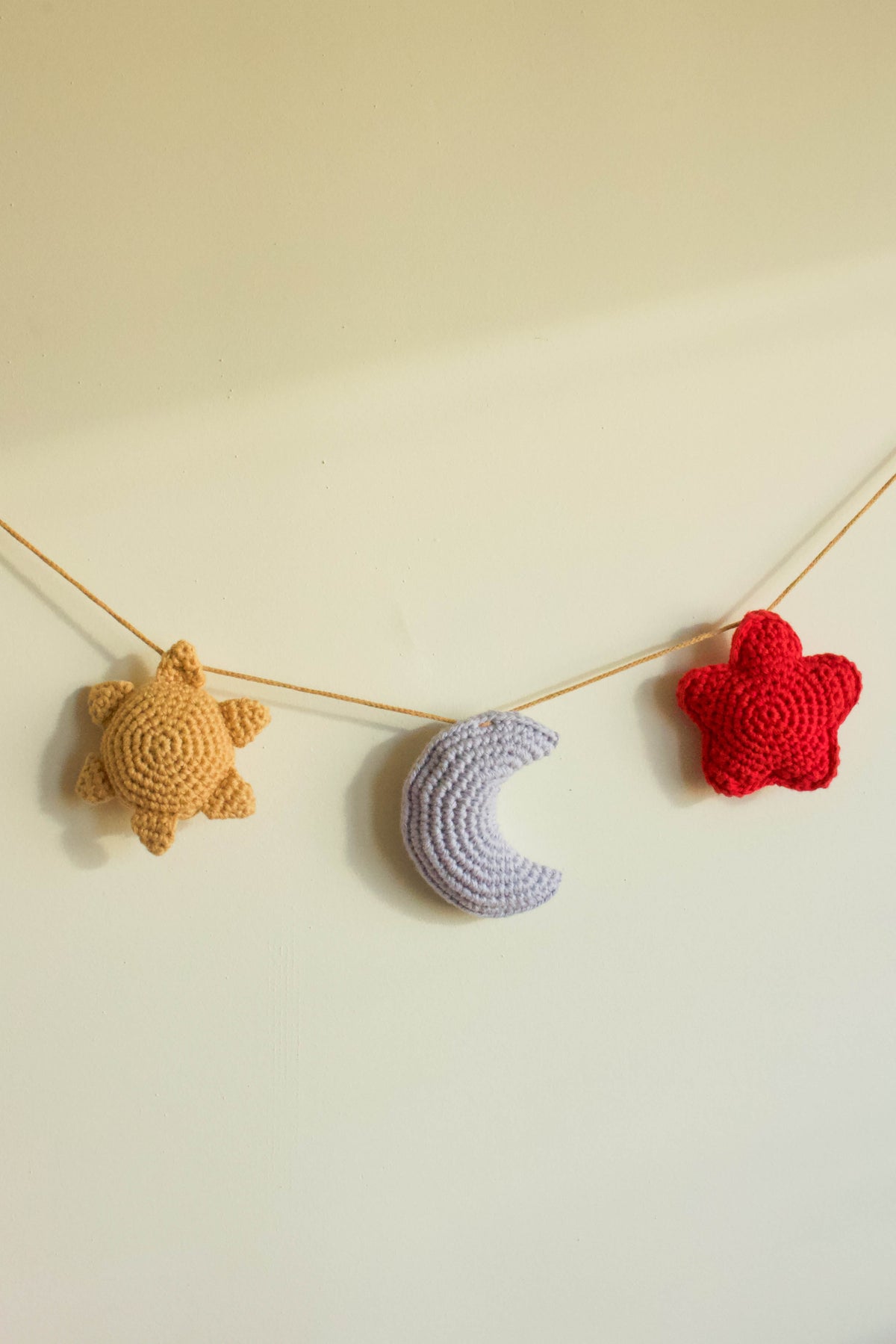 Handmade baby crochet wall hanger - yellow light blue red
