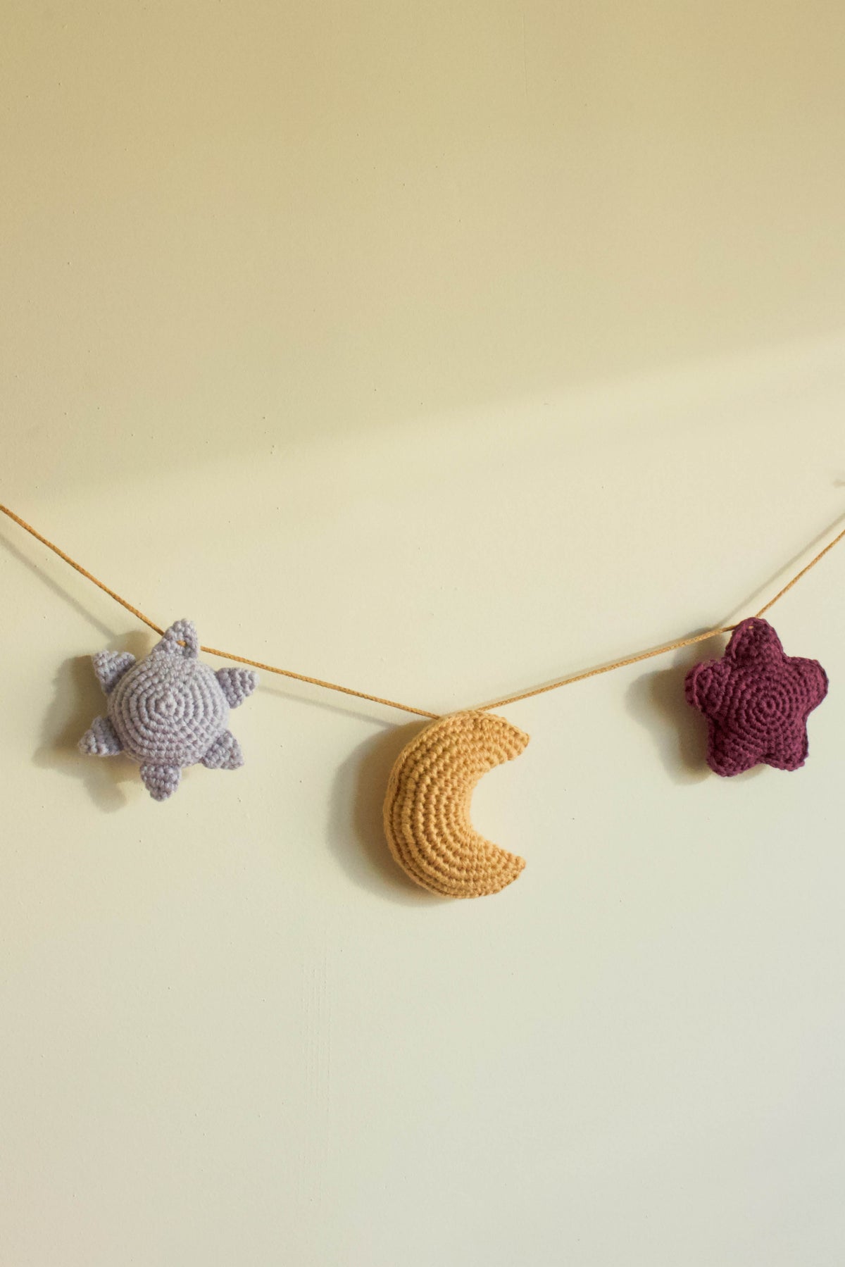 Handmade baby crochet wall hanger - light blue yellow aubergine